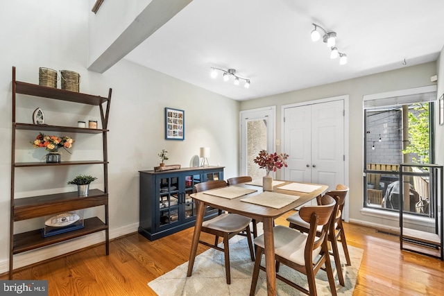 dining room with light hardwood / wood-style flooring