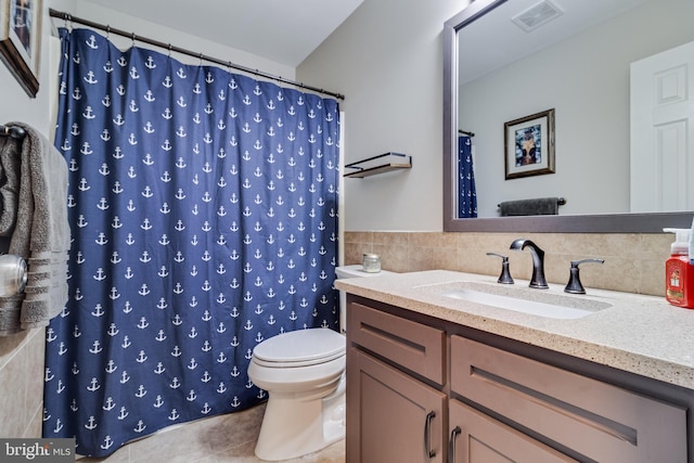 bathroom with tile patterned floors, a shower with curtain, vanity, tile walls, and toilet