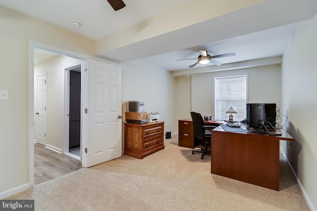 office featuring light carpet and ceiling fan