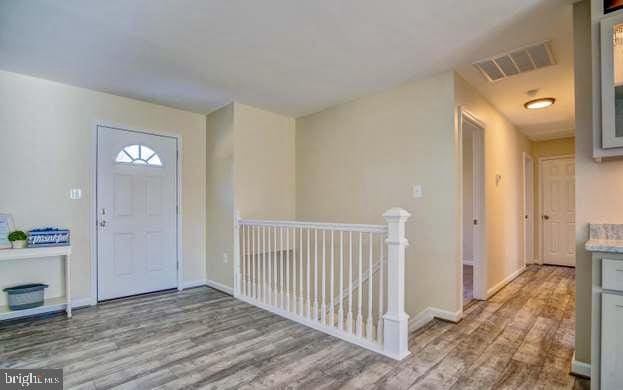 entrance foyer featuring light wood-type flooring