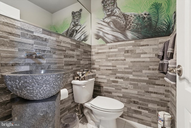 bathroom featuring tile patterned floors, sink, and toilet