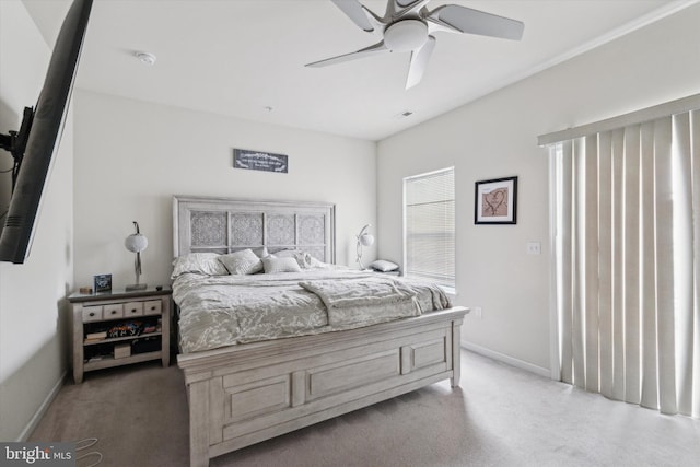 bedroom featuring ceiling fan and light colored carpet