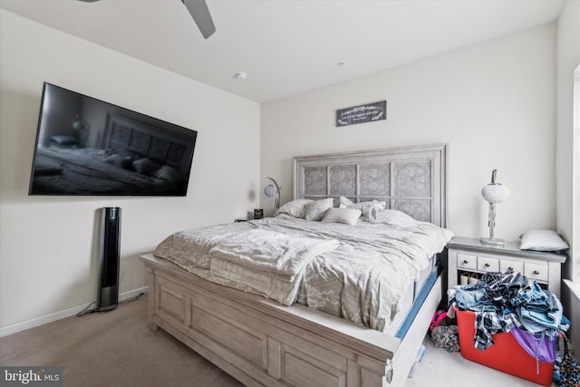 bedroom featuring ceiling fan and light carpet