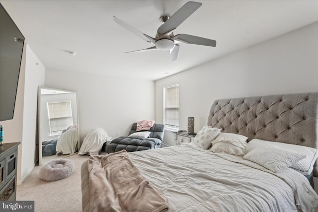 bedroom with ceiling fan and carpet floors