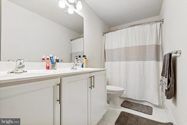 bathroom featuring tile patterned floors, walk in shower, vanity, and toilet