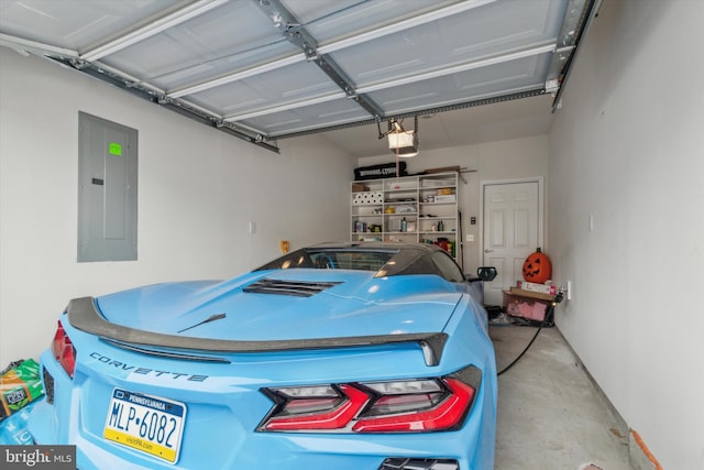 garage featuring electric panel and a garage door opener