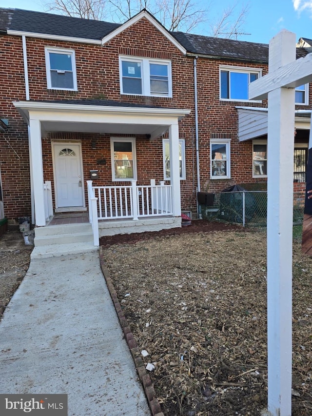 multi unit property featuring a porch