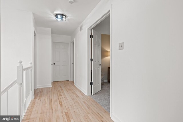 hallway featuring light hardwood / wood-style flooring