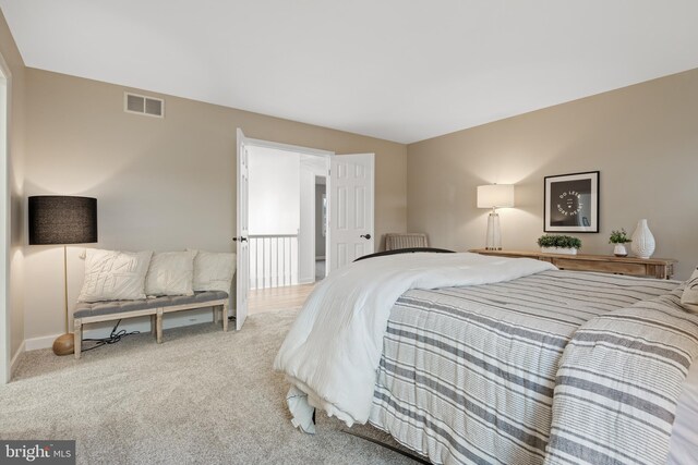 bedroom with light carpet