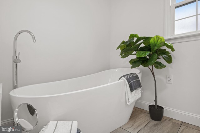 bathroom with a washtub