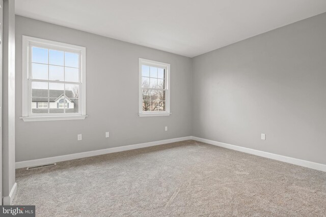 spare room featuring carpet flooring