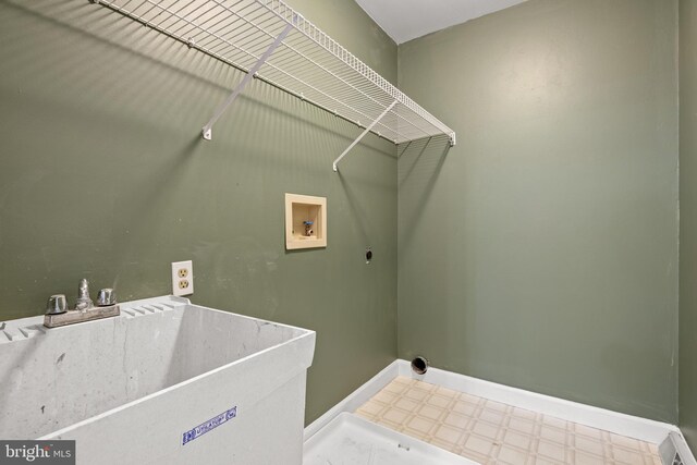 laundry room featuring washer hookup, electric dryer hookup, and sink