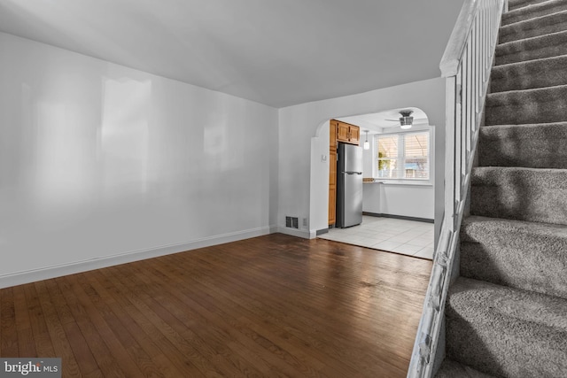 interior space with ceiling fan and light hardwood / wood-style flooring