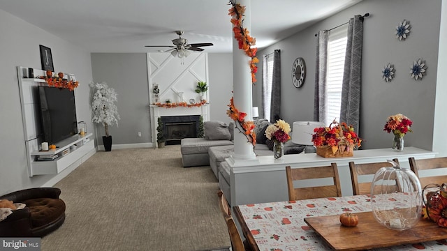 carpeted living room with ceiling fan