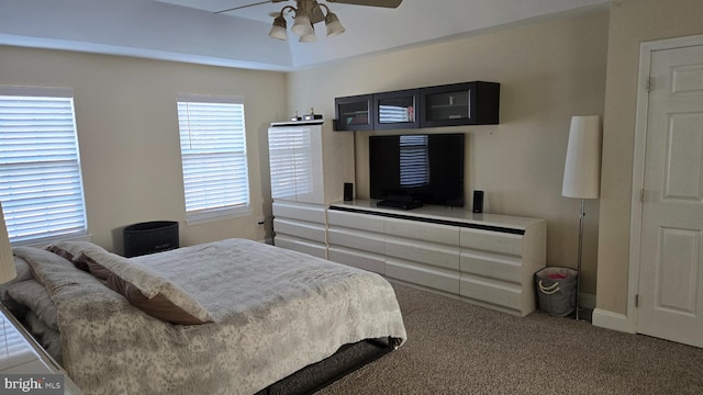 bedroom featuring ceiling fan and carpet