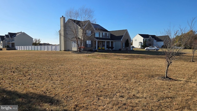 view of front of property featuring a front yard