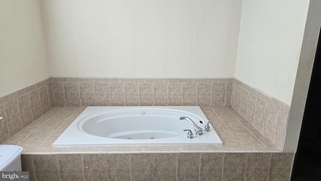 bathroom featuring tiled bath