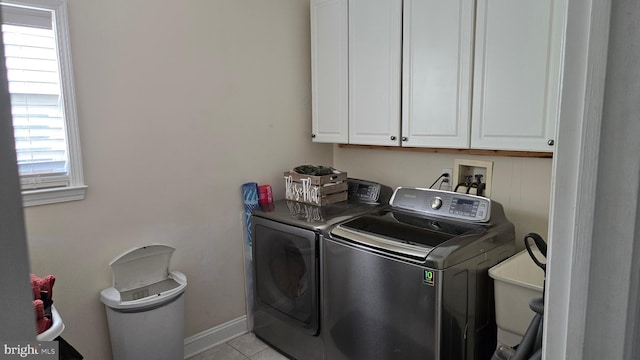 washroom with washer and dryer, sink, cabinets, and light tile patterned flooring