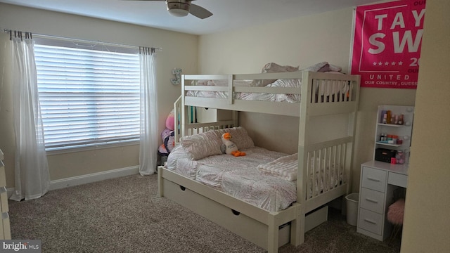 bedroom featuring dark colored carpet and ceiling fan