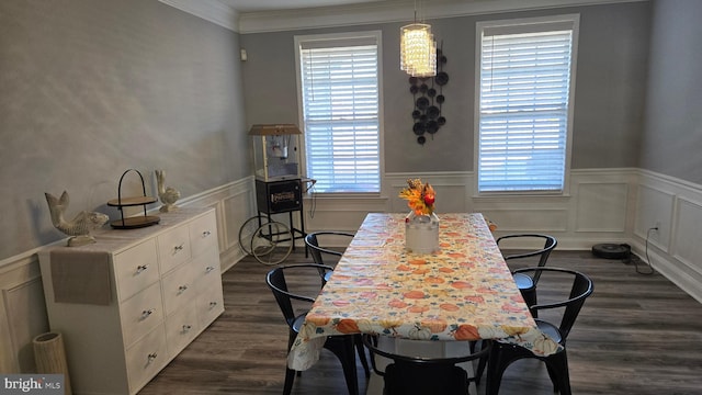 dining room featuring dark hardwood / wood-style floors and ornamental molding