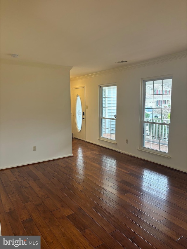 entrance foyer featuring dark hardwood / wood-style floors and ornamental molding