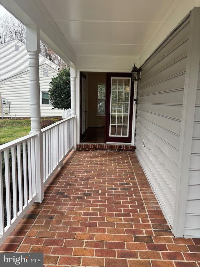 doorway to property featuring a porch