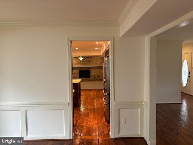 hallway featuring crown molding and dark wood-type flooring