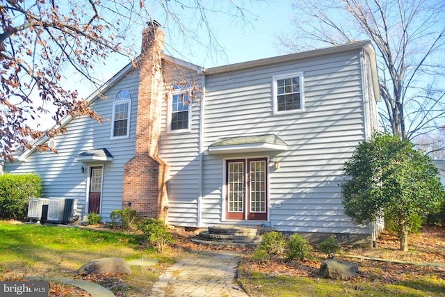 view of front of property featuring central air condition unit