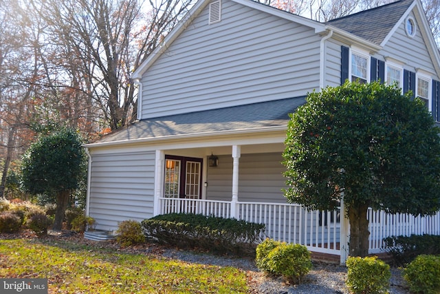 view of property exterior with covered porch