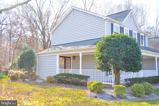 view of side of home featuring a porch