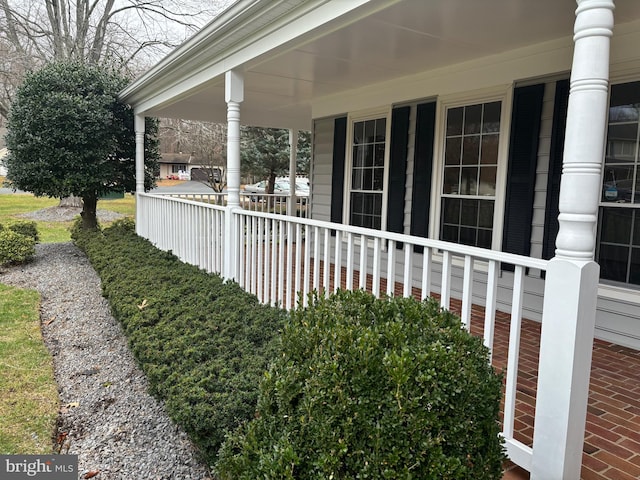 view of side of home featuring a porch