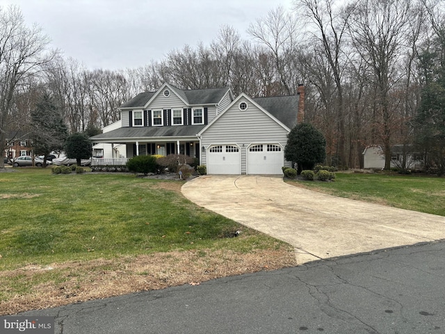 view of property with a porch, a garage, and a front lawn