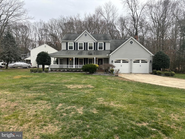 view of front of home with a front lawn, covered porch, and a garage