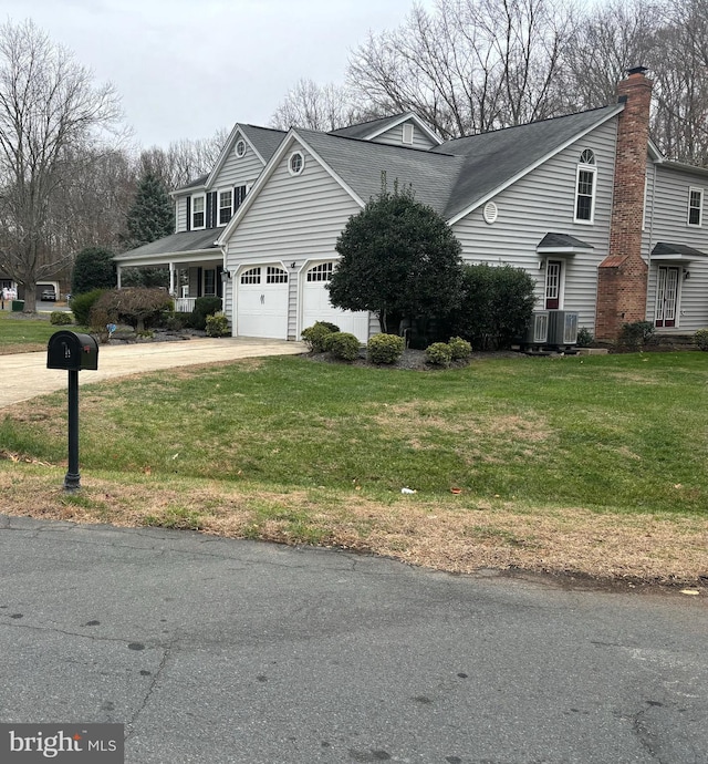 view of home's exterior with a yard and central AC unit