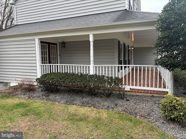 view of exterior entry with covered porch