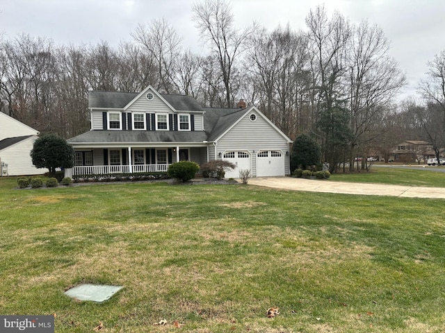 view of front of home featuring a front yard, a porch, and a garage