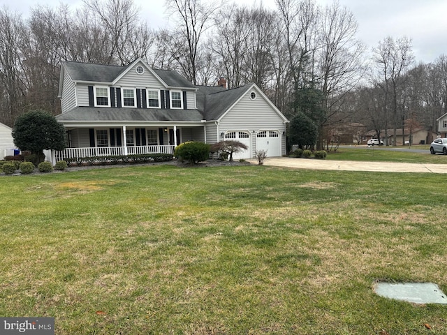 view of front of property featuring a front yard, a porch, and a garage