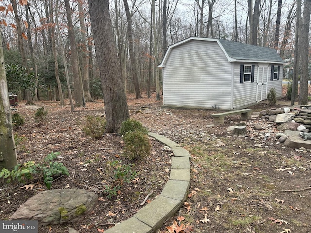 exterior space with a shed