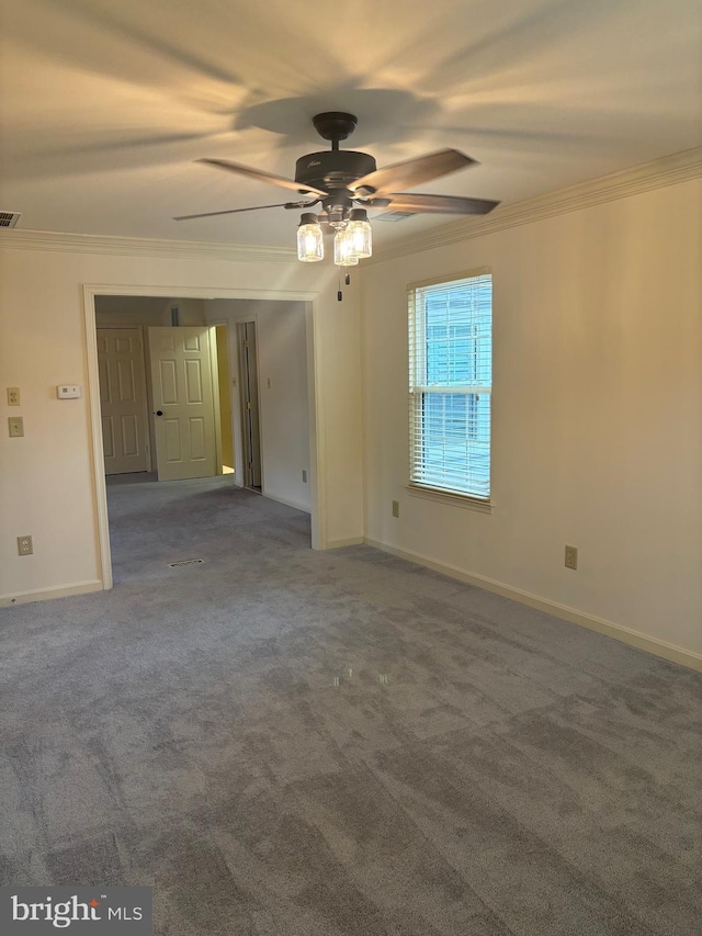 spare room with carpet flooring, ceiling fan, and ornamental molding