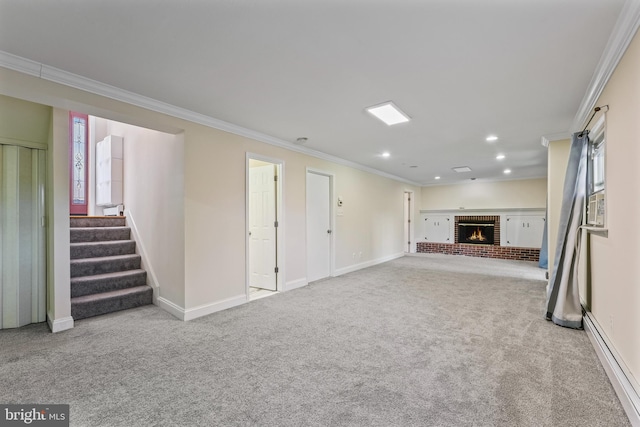 basement with light carpet, ornamental molding, a baseboard radiator, and a brick fireplace