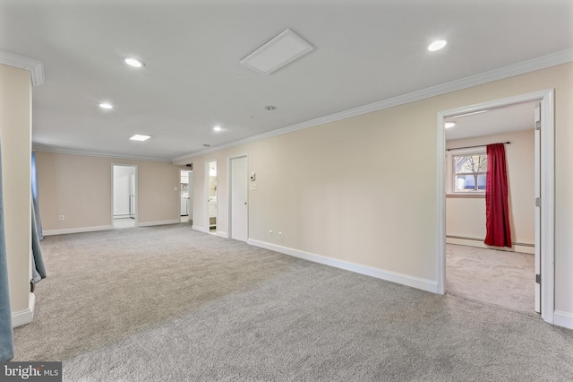 unfurnished room featuring baseboard heating, light carpet, and crown molding