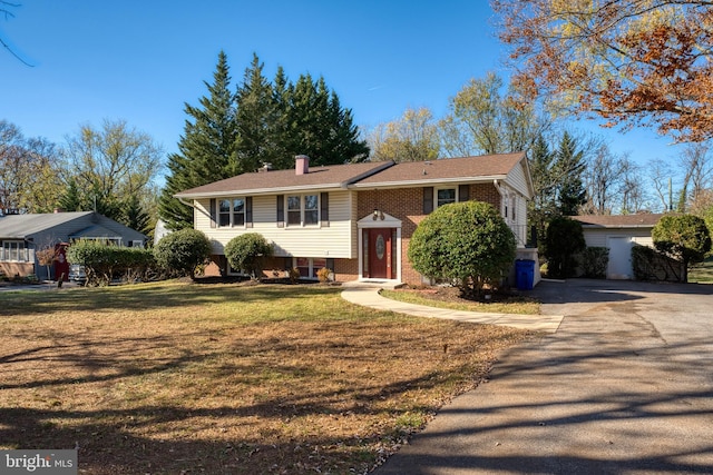 raised ranch featuring a front yard