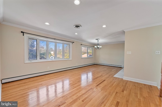 unfurnished room with a notable chandelier, light hardwood / wood-style floors, ornamental molding, and a baseboard radiator