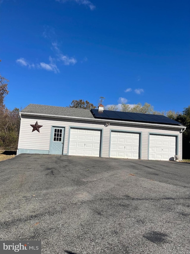 garage featuring solar panels