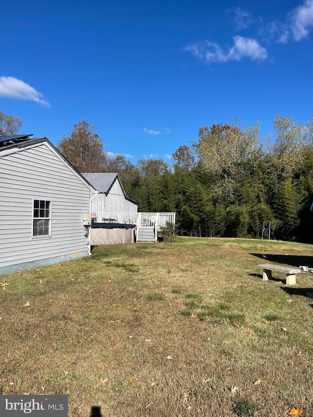 view of yard with a wooden deck