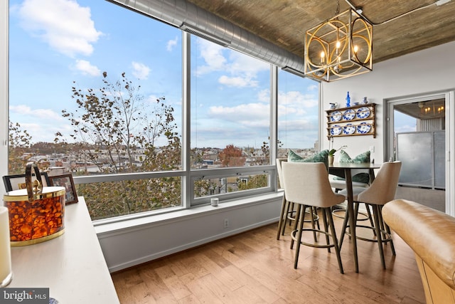 sunroom with an inviting chandelier and plenty of natural light