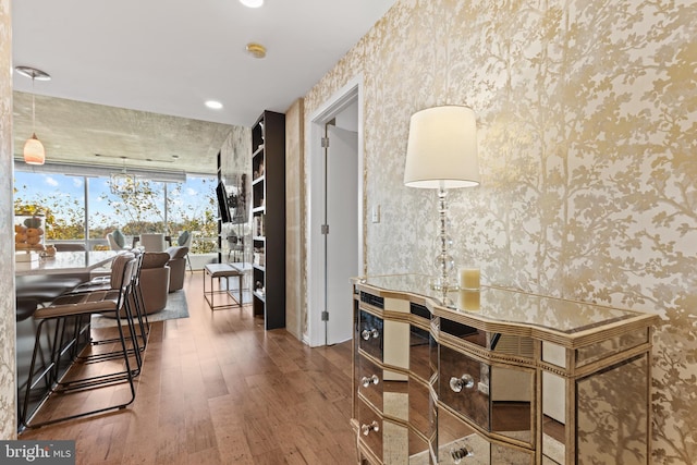 interior space with dark hardwood / wood-style floors and floor to ceiling windows