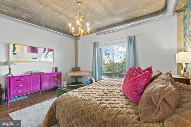 bedroom featuring dark hardwood / wood-style floors and a notable chandelier