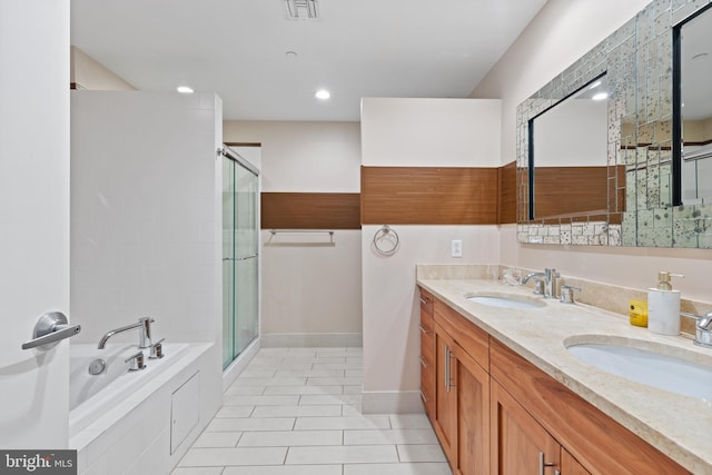 bathroom featuring tile patterned floors, vanity, and separate shower and tub