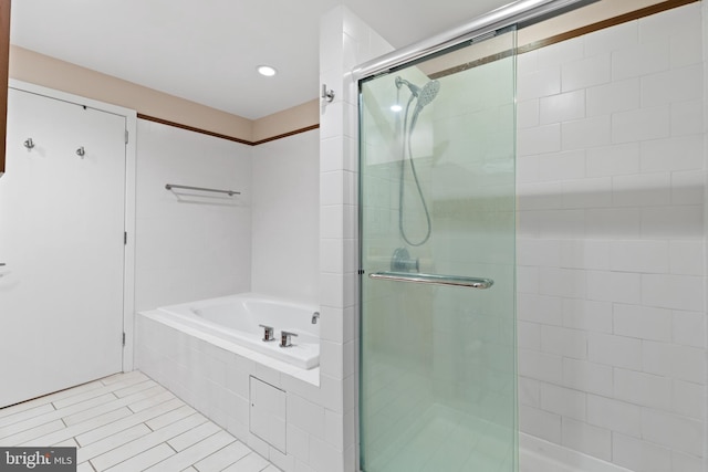 bathroom with plus walk in shower and tile patterned floors